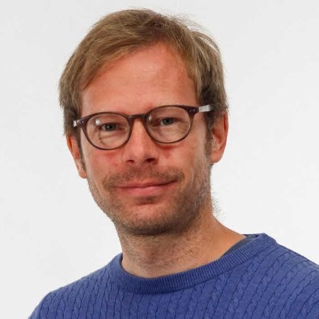 Smiling man in blue sweater