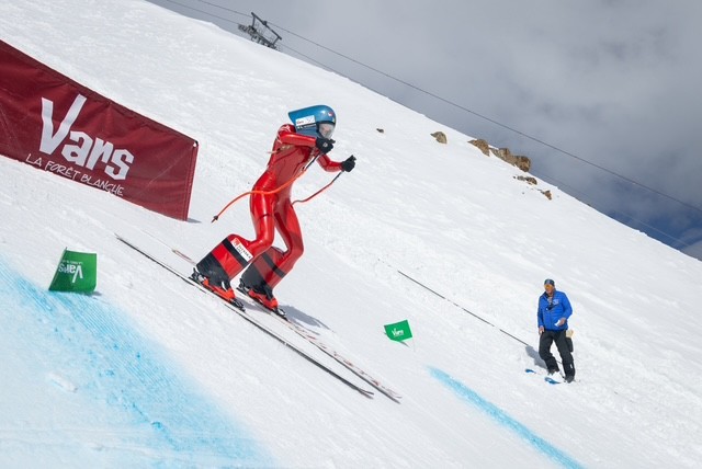 Girl in red ski suit.