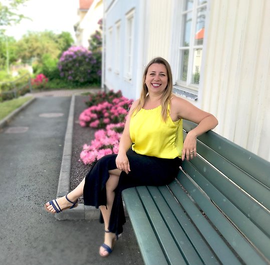 Smiling woman sitting on bench